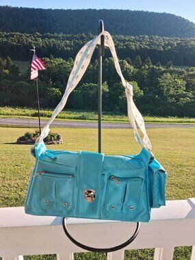 Blue Metallic Shoulder Bag White Grommet Strap & Multiple Zipper Pockets
